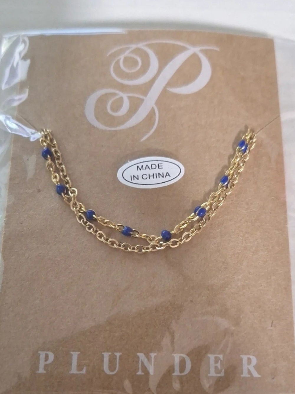 Plunder Gold Necklace with Blue Bead Accents